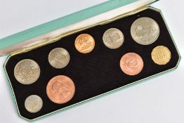 AN ELIZABETH II 1964 YEAR COIN SET, to include a 1964 full gold Sovereign coin in UNC condition