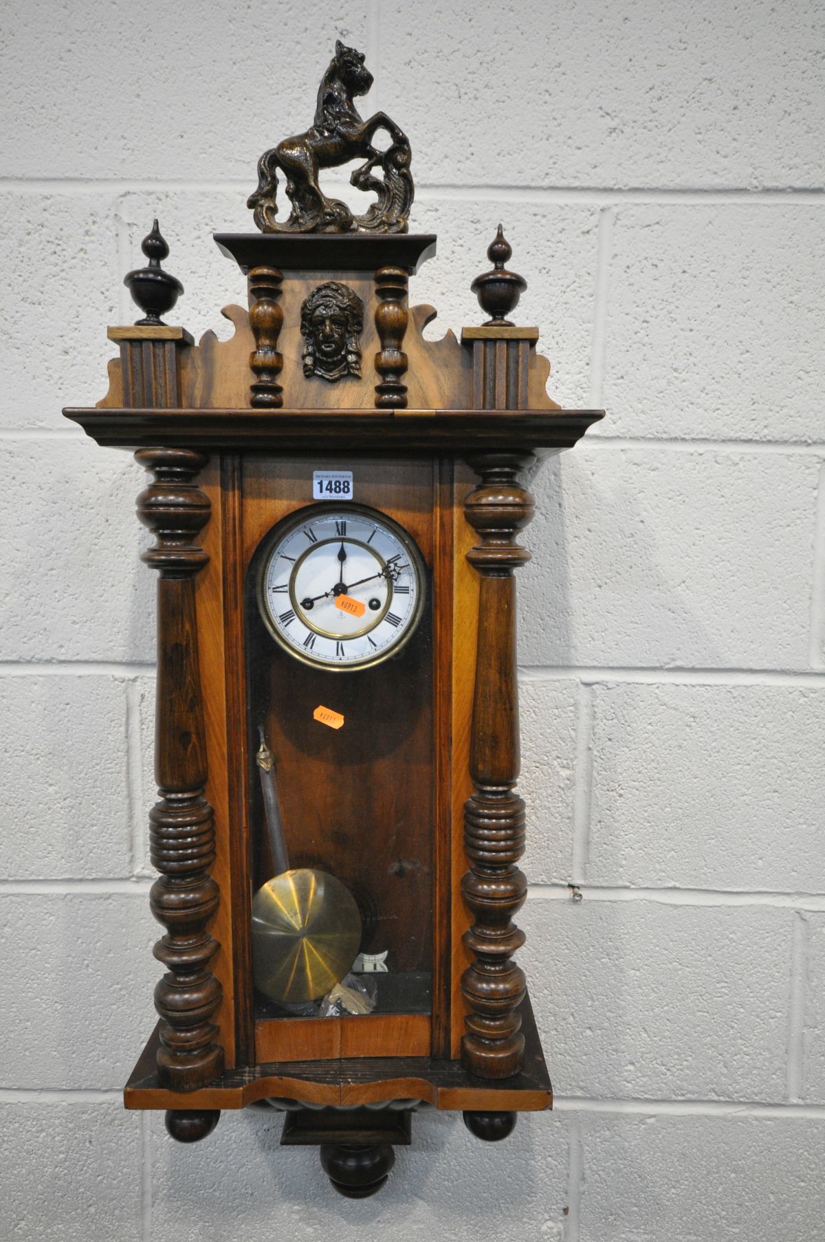 A LATE VICTORIAN GUSTAV BECKER WALNUT VIENNA WALL CLOCK, with ceramic horse pediment, winding key