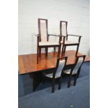 A ROSEWOOD EFFECT DANISH/SWEDISH STYLE EXTENDING DINING TABLE, on twin V shaped legs, with a