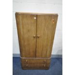 AN ART DECO WALNUT TWO DOOR CABINET, with two drawers, width 81cm x depth 50cm x height 152cm (key)