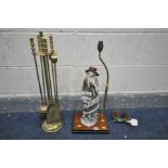 A FOUR PIECE BRASS COMPANION SET, with stand, along with figural table lamp of a standing female,