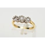 AN 18CT GOLD THREE STONE DIAMOND RING, the three graduated diamonds in illusion settings, leading on