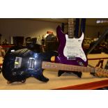 TWO ENCORE STRAT TYPE ELECTRIC GUITARS one in translucent purple finish with white pearloid