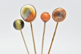 FOUR GEM SET STICKPINS, four pins, two set with operculum, one set with an orange opaque stone and