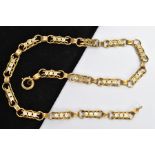 A VICTORIAN GOLD CHAIN, a fancy link chain with a repeating floral pattern, fitted with a textured