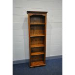 A MODERN PINE NARROW BOOKCASE with two fixed and a two adjustable shelves width 60cm x depth 129cm x