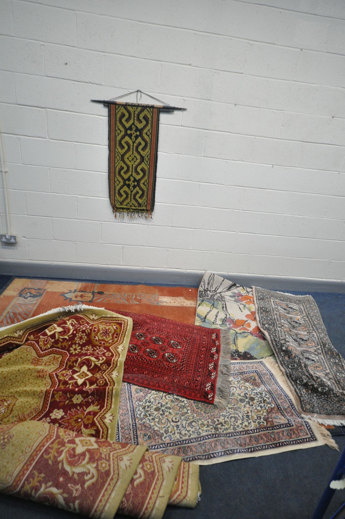A COLLECTION OF SIX RUGS AND RUNNERS including two small rugs one in hand knotted red, length