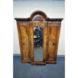 A VICTORIAN WALNUT BREAKFRONT TRIPLE DOOR WARDROBE, with book matched figured walnut veneers to