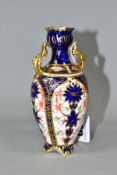 A ROYAL CROWN DERBY IMARI SMALL TWIN HANDLED BALUSTER VASE IN THE 1128 PATTERN, printed and