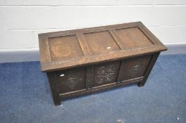 A SMALL MID 20th CENTURY BLANKET CHEST with three solid oak carved fielded panels to front, three