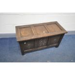 A SMALL MID 20th CENTURY BLANKET CHEST with three solid oak carved fielded panels to front, three