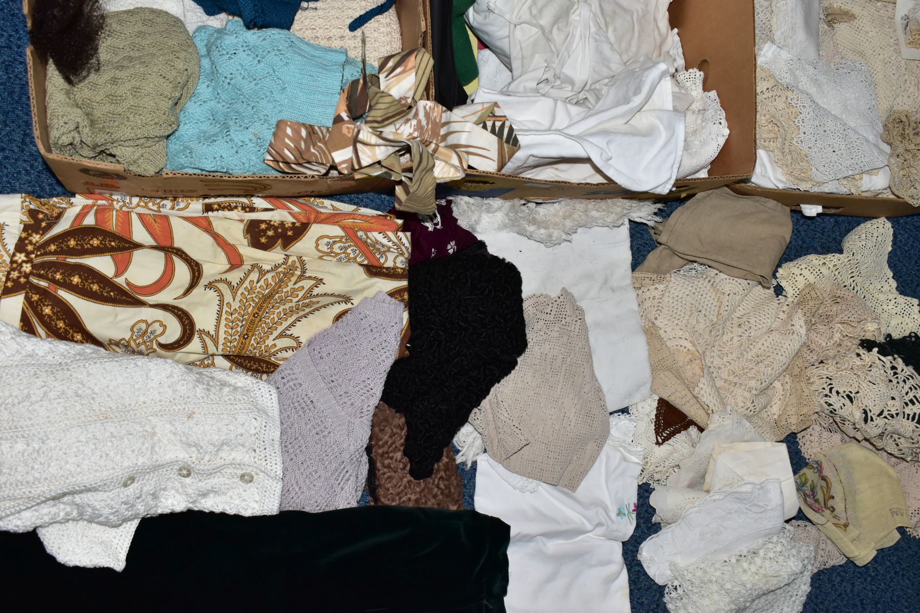 THREE BOXES OF VINTAGE CLOTHING AND TABLE LINENS, to include a box of skirts and knitwear in a range