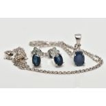 SAPPHIRE AND DIAMOND NECKLACE AND EARRINGS, the pendant set with an oval cut sapphire in a basket