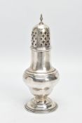AN EDWARDIAN SILVER CASTER, of baluster form with pierced cross detail to the lid and circular