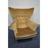 A G PLAN MODEL 6250 GOLD UPHOLSTERED WING BACK ARMCHAIR, on rosewood effect legs, on casters (this