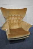 A G PLAN MODEL 6250 GOLD UPHOLSTERED WING BACK ARMCHAIR, on rosewood effect legs, on casters (this