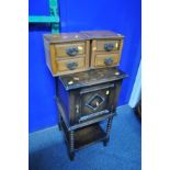 AN EARLY 20th CENTURY SMOKERS CUPBOARD with single door enclosing a fitted interior, over bobbin