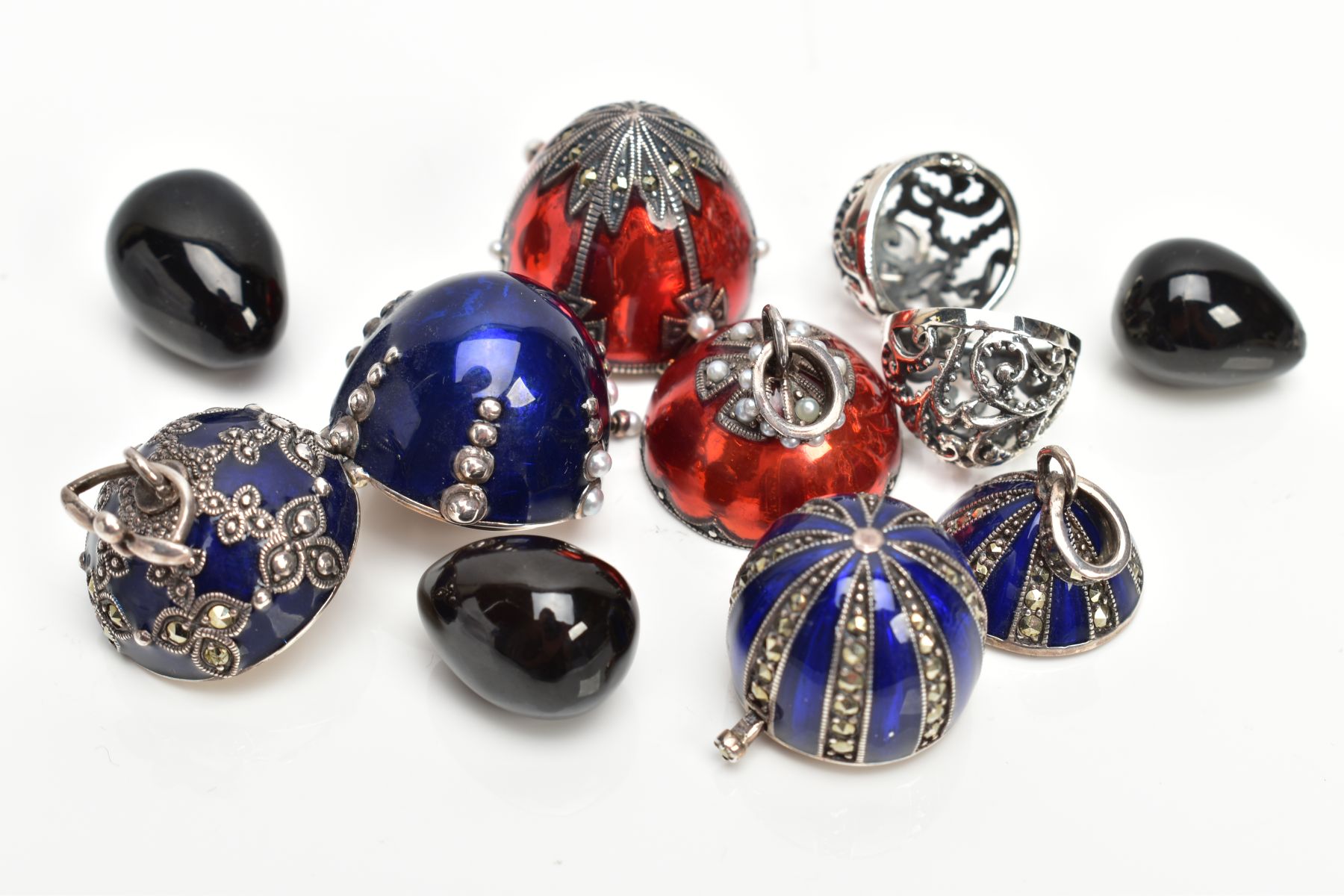 FOUR WHITE METAL AND ENAMEL EGG PENDANTS, to include a white metal openwork egg fitted with a - Image 5 of 5