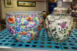 A 20TH CENTURY CHINESE STORAGE JAR WITH LID, decorated with foliage and birds, the base is unmarked,