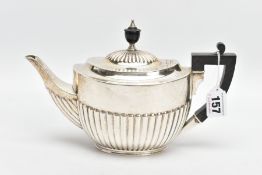 A SILVER TEAPOT, tapered stop reeded design, fitted with a black wooden handle and finial,