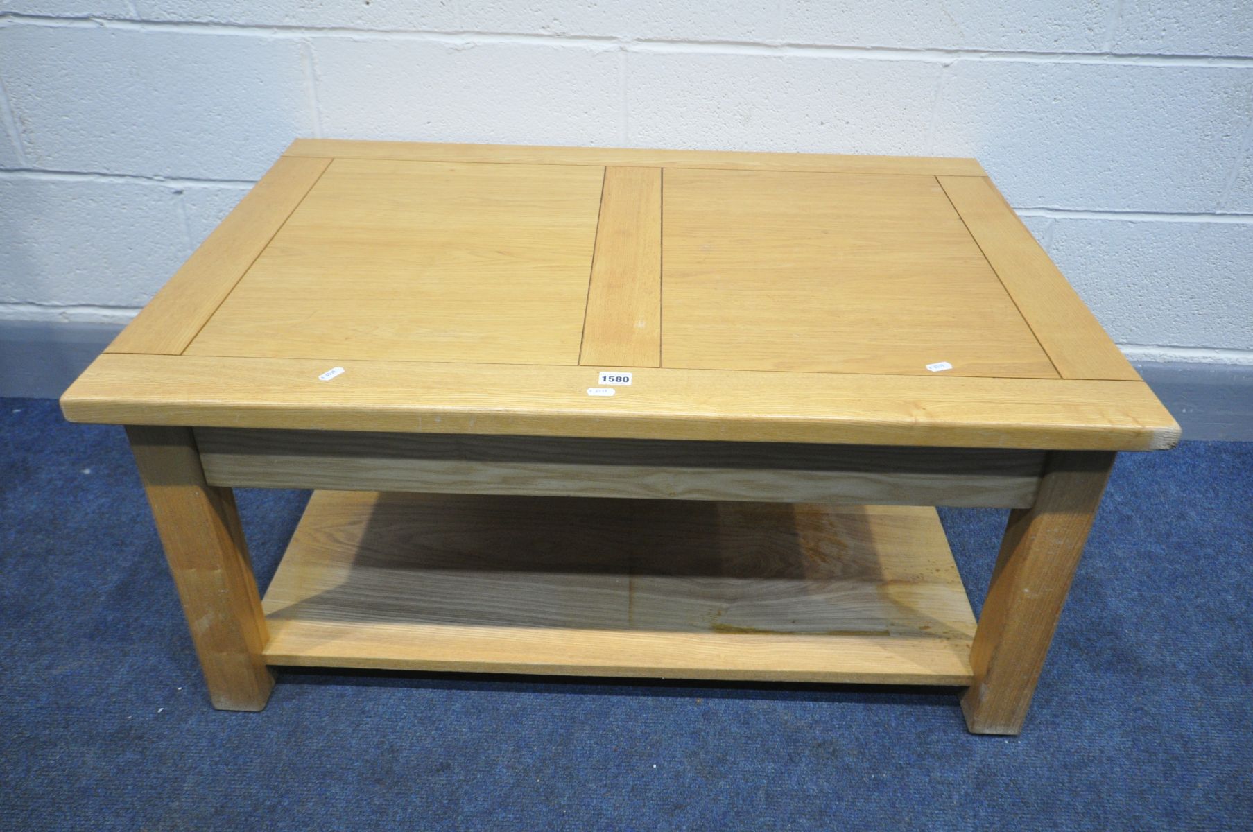 A 'HALO LIVING' LIGHT OAK COFFEE TABLE, width 101cm x depth 70cm x height 47cm