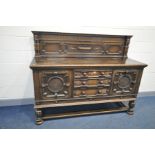 AN EARLY 20th CENTURY HEAVILY CARVED OAK SIDEBOARD with raised back, geometric detailing, two