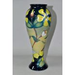 A MOORCROFT POTTERY HYPERICUM PATTERN SLENDER BALUSTER VASE, with tube lined Hypericum pattern on