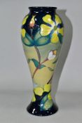 A MOORCROFT POTTERY HYPERICUM PATTERN SLENDER BALUSTER VASE, with tube lined Hypericum pattern on