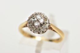 AN 18CT GOLD DIAMOND CLUSTER RING, slightly raised circular cluster ring, set with single cut