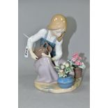 A LLADRO FIGURE 'WATERING THE FLOWER-POTS' NO.1376, sculpted by Juan Huerta, issued 1978-1990,