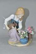 A LLADRO FIGURE 'WATERING THE FLOWER-POTS' NO.1376, sculpted by Juan Huerta, issued 1978-1990,