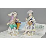 A PAIR OF EARLY 20TH CENTURY MEISSEN FIGURES OF A YOUNG BOY AND GIRL, both seated, the boy holding a