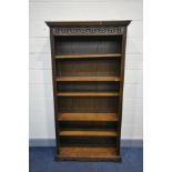 AN OLD CHARM OAK BOOKCASE with two fixed and three moveable shelves (one shelf pin missing) width