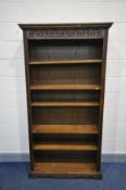 AN OLD CHARM OAK BOOKCASE with two fixed and three moveable shelves (one shelf pin missing) width