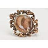 A LATE VICTORIAN MEMORIAL BROOCH, the central oval arranged hair panel with split pearl detail, to