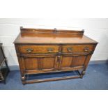 AN EARLY 20th CENTURY OAK SIDEBOARD with a solid oak top, door panels and drawer fronts width