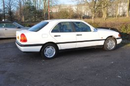 A 1995 MERCEDES C180 CLASSIC FOUR DOOR SALOON CAR IN WHITE 1.8 litre petrol engine 5 speed manual