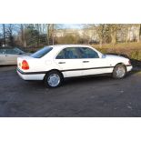A 1995 MERCEDES C180 CLASSIC FOUR DOOR SALOON CAR IN WHITE 1.8 litre petrol engine 5 speed manual