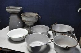 A SELECTION OF STEEL AND ALUMINIUM POTS to include two pairs of aluminium cauldrons, a Thames milk