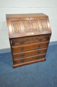 AN OLD CHARM FALL FRONT BUREAU with linen fold detailing to fall front and four drawers below