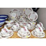 A FIFTY ONE PIECE ROYAL ALBERT LAVENDER ROSE DINNER SERVICE, comprising a teapot, a tureen, a