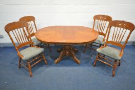 AN OAK OVAL EXTENDING DINING TABLE with four matching chairs, width 152cm x depth 106cm x height