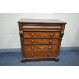 A VICTORIAN SCOTCH CHEST OF FIVE LONG DRAWERS the top one being shaped with turned handles and
