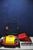 A WOLFGARTEN VS302E ELECTRIC LAWN RAKE with grass box and replacement blades (untested due to no