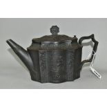 AN EARLY NINETEENTH CENTURY BLACK BASALT TEAPOT, with octagonal finial bearing a sun motif on a