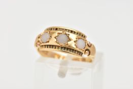 A LATE 19TH CENTURY 18CT GOLD RING, designed with three circular white worn cabochons, textured