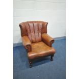 A MODERN TAN SOFT LEATHER ARMCHAIR with ball and claw feet (condition:- no rips, Tears or major