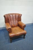 A MODERN TAN SOFT LEATHER ARMCHAIR with ball and claw feet (condition:- no rips, Tears or major