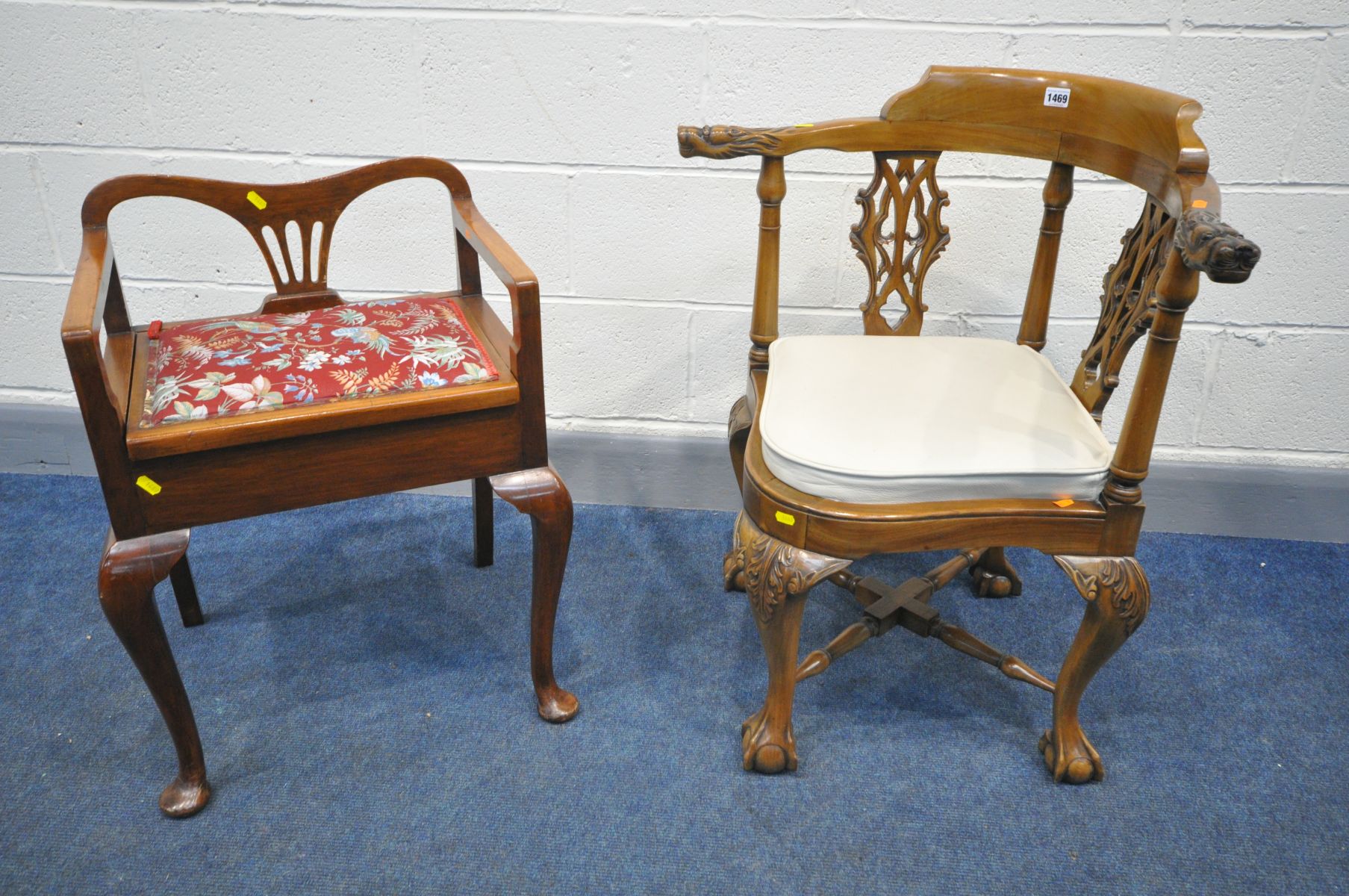 A REPRODUCTION GILLOWS STYLE CORNER CHAIR with shaped and pierced splats, lion head arm