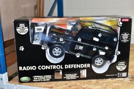 A BOXED HALSALL PLASTIC RADIO CONTROLLED LAND ROVER DEFENDER, No.TL419, not tested, without